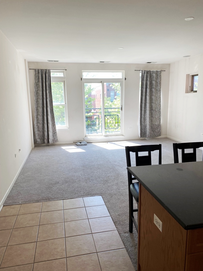 1415 South Halsted Street, Unit 3A Chicago, IL 60607 - Photo 6 of 14 a view of a kitchen with furniture and windows