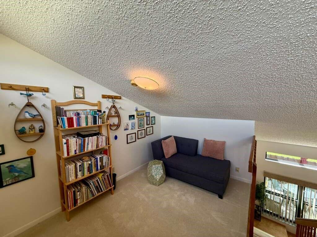 13929 Nesting Way, Unit B Delray Beach, FL 33484 - Photo 15 of 29 a living room with furniture and a shelf