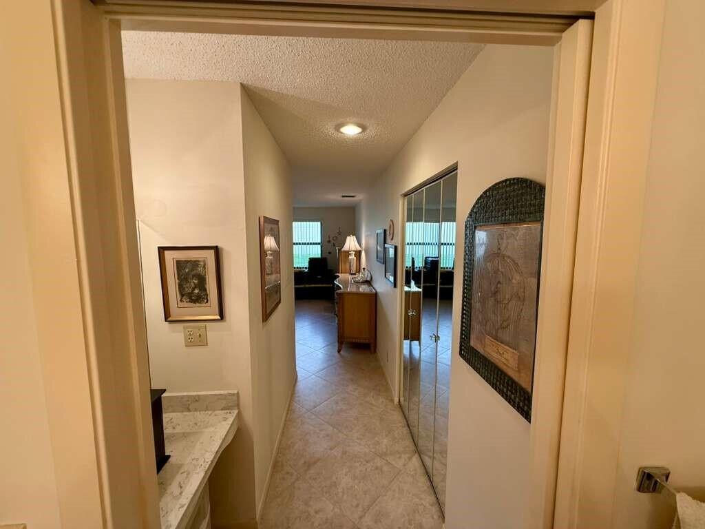 13929 Nesting Way, Unit B Delray Beach, FL 33484 - Photo 19 of 29 a view of a hallway view with living room