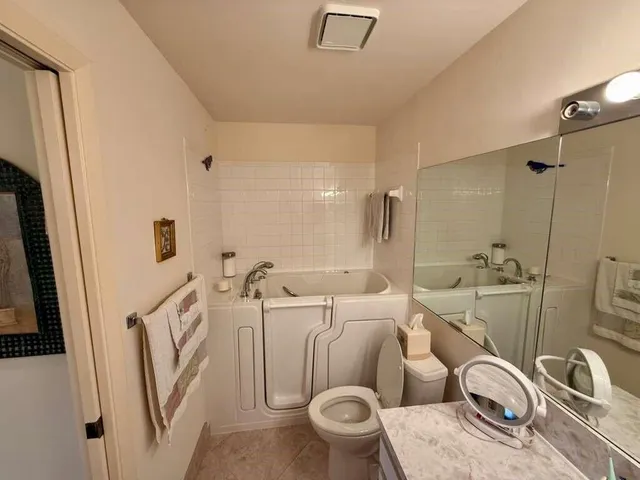 a bathroom with a sink a washer and dryer