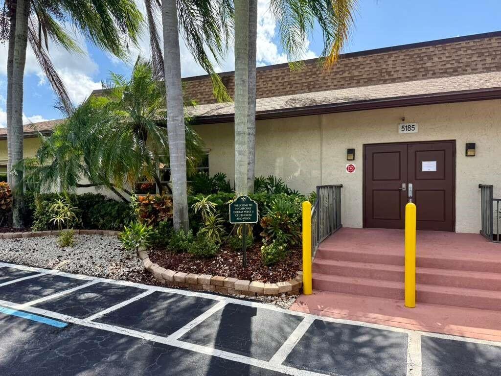 13929 Nesting Way, Unit B Delray Beach, FL 33484 - Photo 25 of 29 a front view of a house with garden