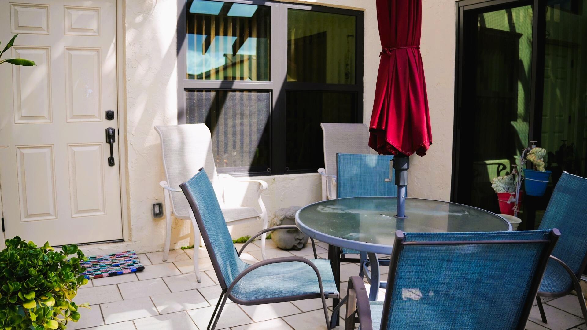 13929 Nesting Way, Unit B Delray Beach, FL 33484 - Photo 4 of 29 a dining room with a table and chairs