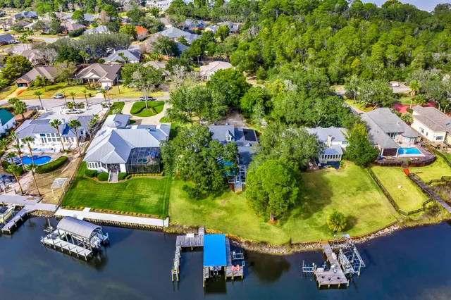 an aerial view of a house with a swimming pool yard and outdoor seating