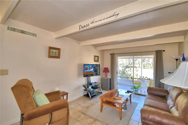 a living room with furniture or couch and a window