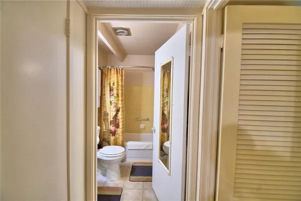 a bathroom with a glass door shower