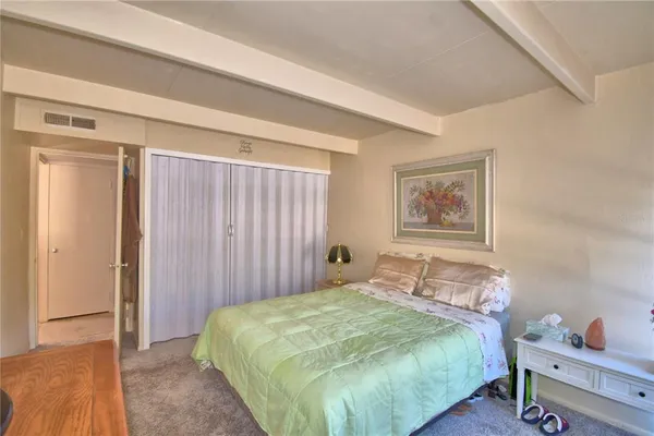 a bedroom with a bed and a cabinets