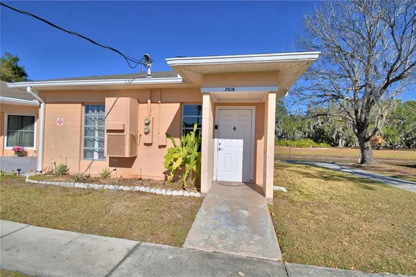 a view of a house with a yard