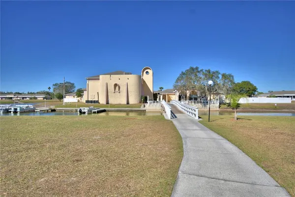 a view of a yard in front of the house with a yard