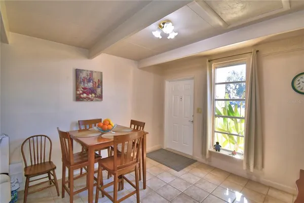 a dining room with furniture and window