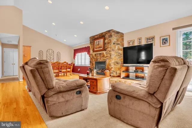 a kitchen with stainless steel appliances granite countertop a refrigerator sink and cabinets