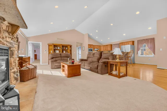 a large kitchen with a table and chairs