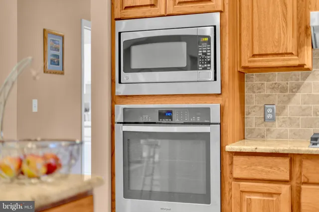 a bedroom with furniture and a chandelier