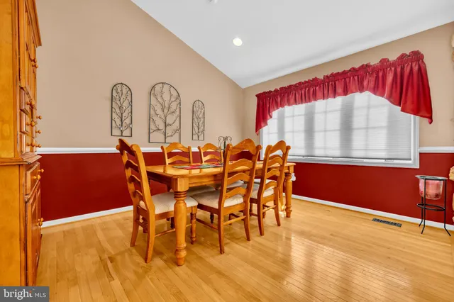 a bathroom with a sink a mirror and a window