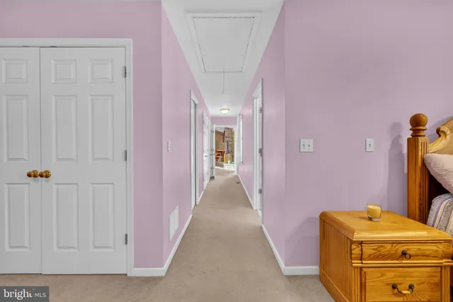 a room with a dresser and a window