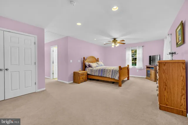 a bedroom with a bed and a table