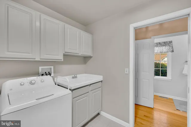 a view of a room with wooden floor and gym equipment