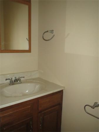1134 Worcester Street Springfield, MA 01151 - Photo 11 of 14 a bathroom with a sink and a mirror