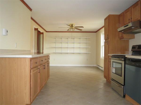 1134 Worcester Street Springfield, MA 01151 - Photo 4 of 14 a view of a kitchen with cabinets and appliances