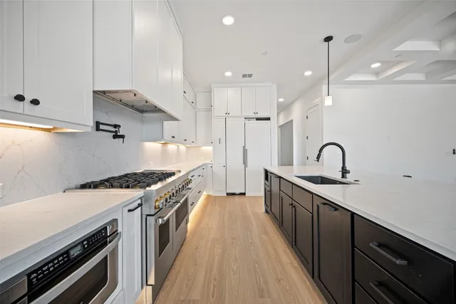 a view of an empty room with a fireplace and a large window