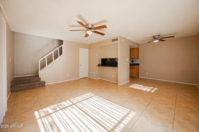 a view of a livingroom with a staircase