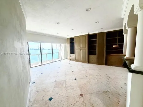 a view of an empty room with a window