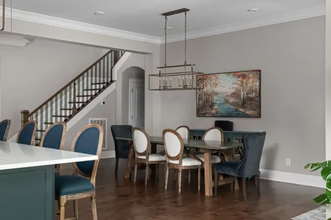 a aerial view of a house with swimming pool and furniture