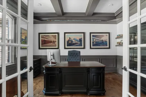 a bathroom with a granite countertop bathtub sink vanity and mirror
