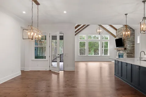 a spacious bathroom with a granite countertop double vanity sink mirror and