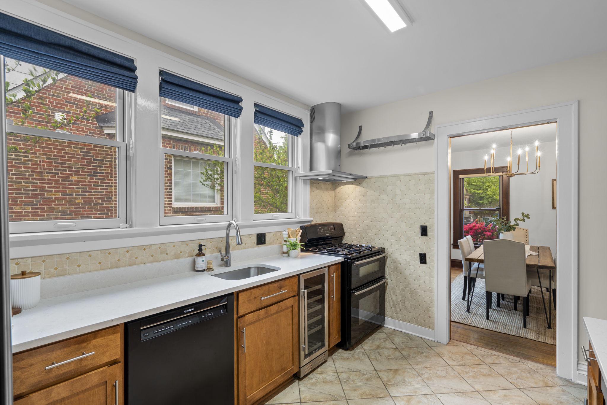9409 Garwood Street Silver Spring, MD 20901 - Photo 18 of 49 Kitchen with gas cooking and hood range.
