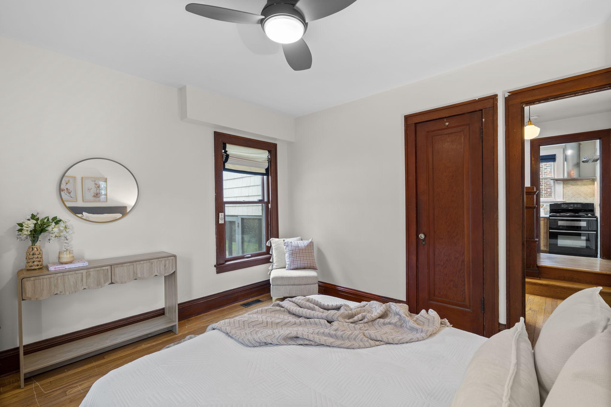 9409 Garwood Street Silver Spring, MD 20901 - Photo 23 of 49 Main level bedroom with classic wood trim.