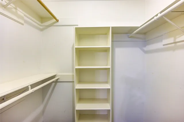 a view of an empty walk in closet