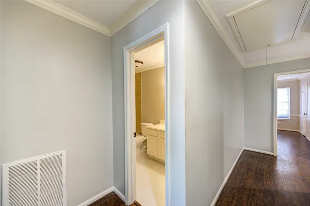 a view of a bathroom from a hallway