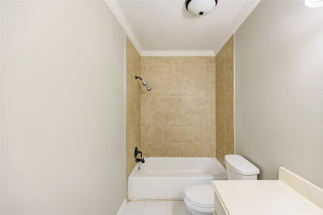 a bathroom with a bathtub shower sink vanity and toilet