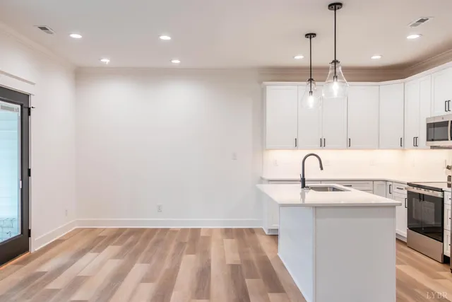 a view of a kitchen with a sink and dishwasher