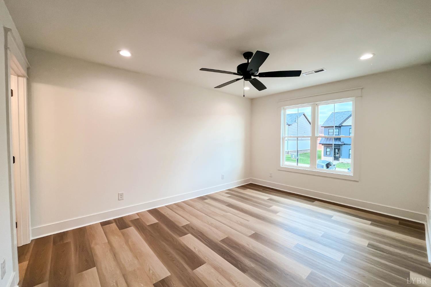 179 Luke Court Rustburg, VA 24588 - Photo 29 of 53 an empty room with windows and fan