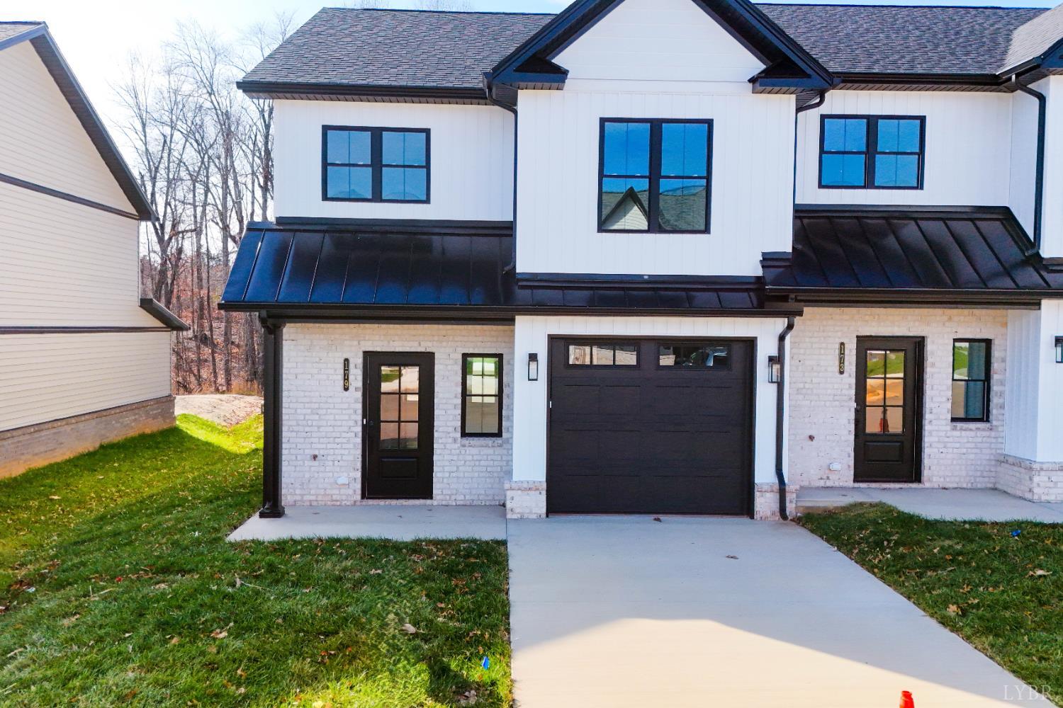 179 Luke Court Rustburg, VA 24588 - Photo 3 of 53 a front view of a house with garden