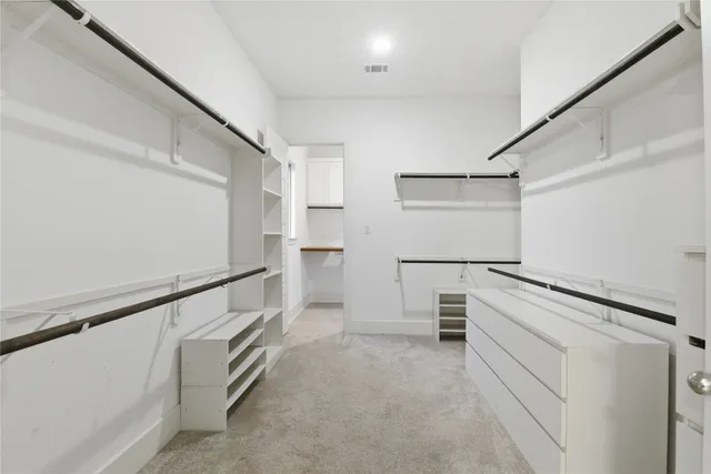 a view of an empty walk in closet