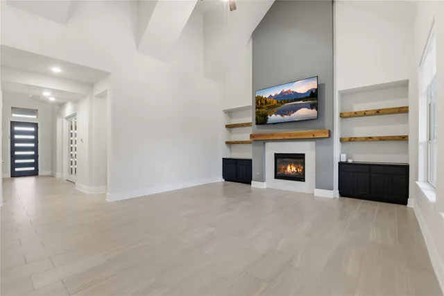 a view of an empty room with a fireplace