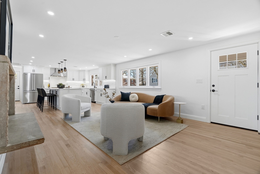 171 Shaw Road Brookline, MA 02467 - Photo 11 of 42 a living room with furniture and a wooden floor