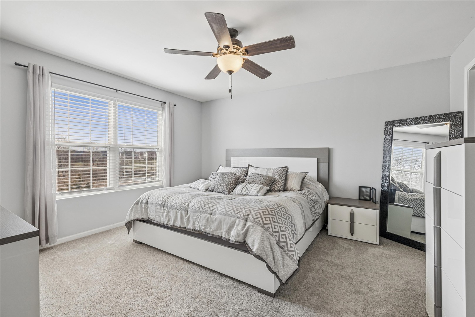 16224 Golf View Drive Lockport, IL 60441 - Photo 14 of 21 a bedroom with a bed and a large window