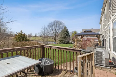a view of a balcony with furniture