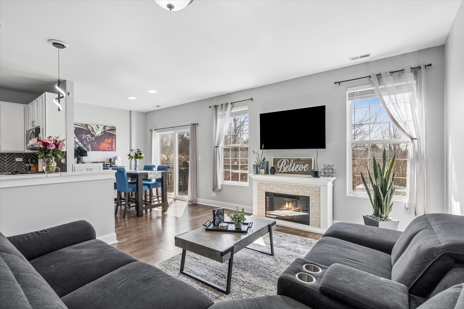 16224 Golf View Drive Lockport, IL 60441 - Photo 2 of 21 a living room with furniture a fireplace and a flat screen tv