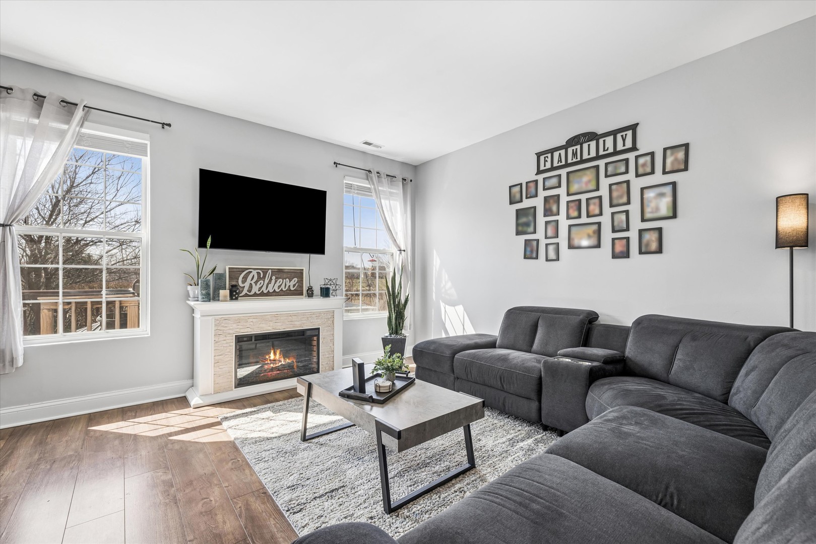 16224 Golf View Drive Lockport, IL 60441 - Photo 5 of 21 a living room with furniture a fireplace and a flat screen tv