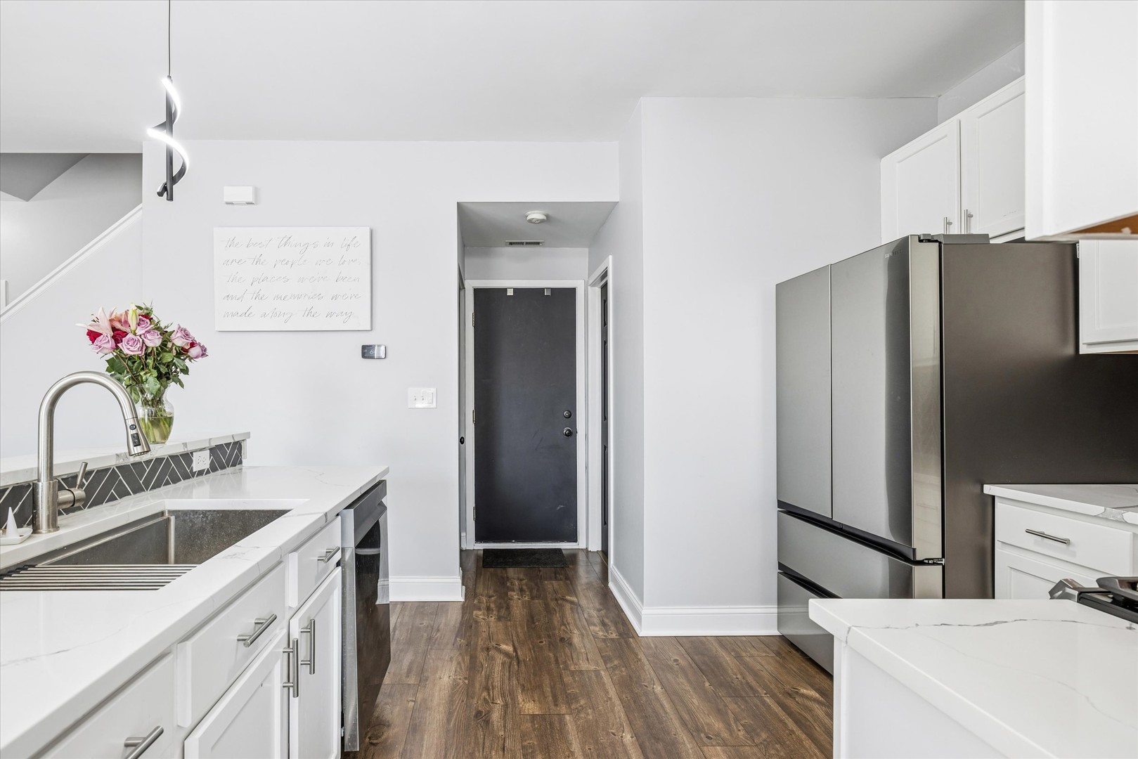 16224 Golf View Drive Lockport, IL 60441 - Photo 10 of 21 a kitchen with stainless steel appliances a sink dishwasher a refrigerator and a stove with wooden floor