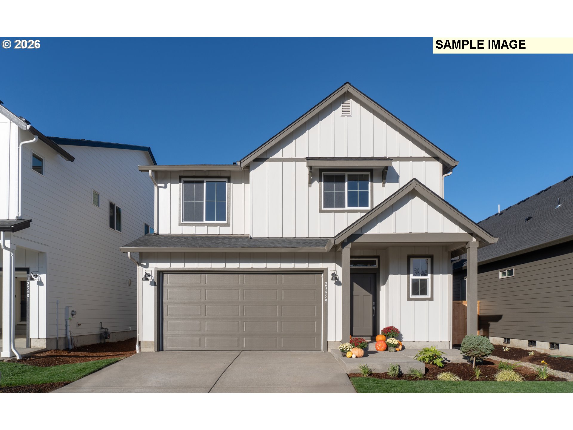 a front view of a house with a garage
