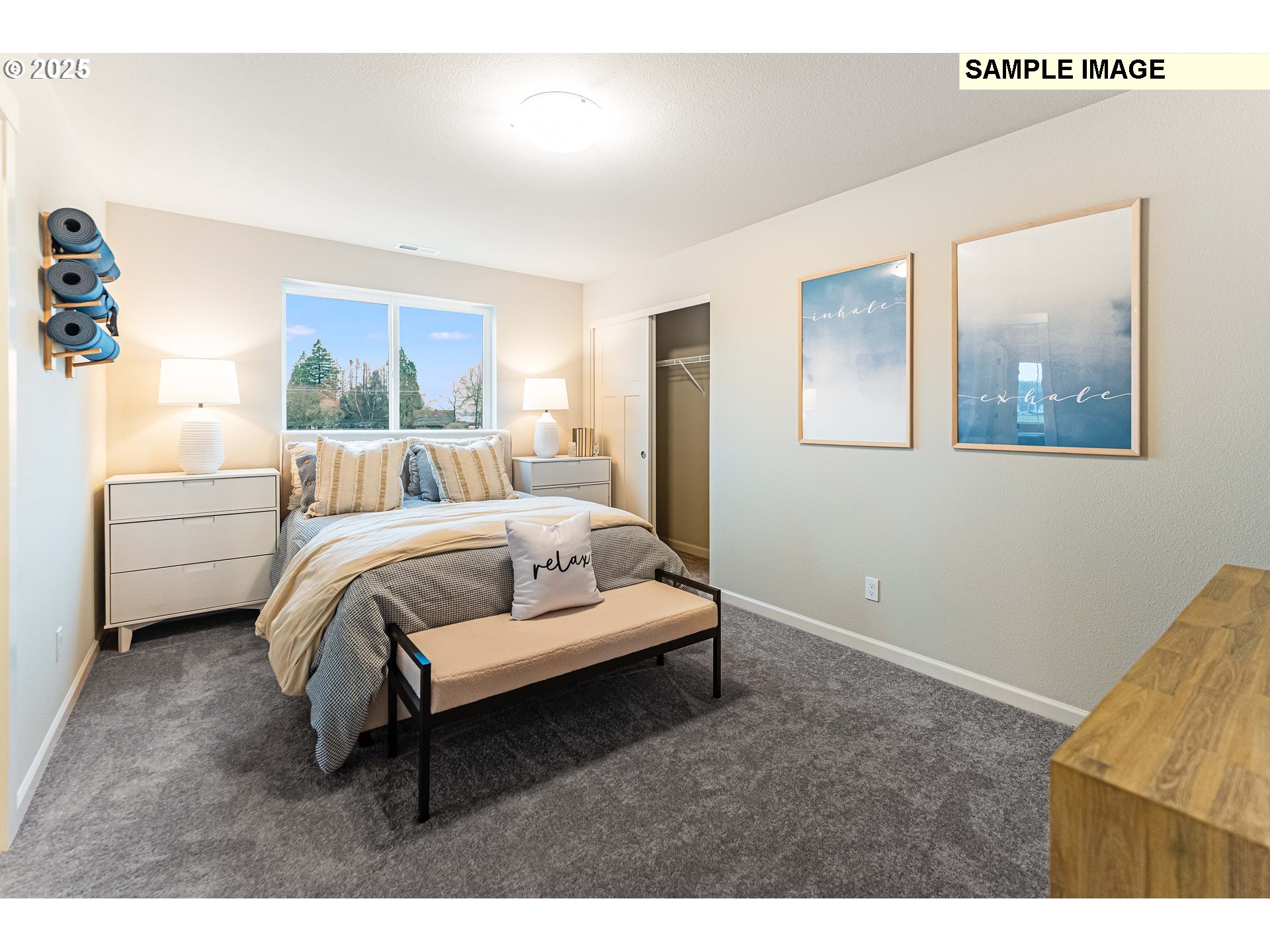 8921 Southwest Choke Cherry Tualatin, OR 97062 - Photo 14 of 28 a bedroom with a bed and a painting on the wall