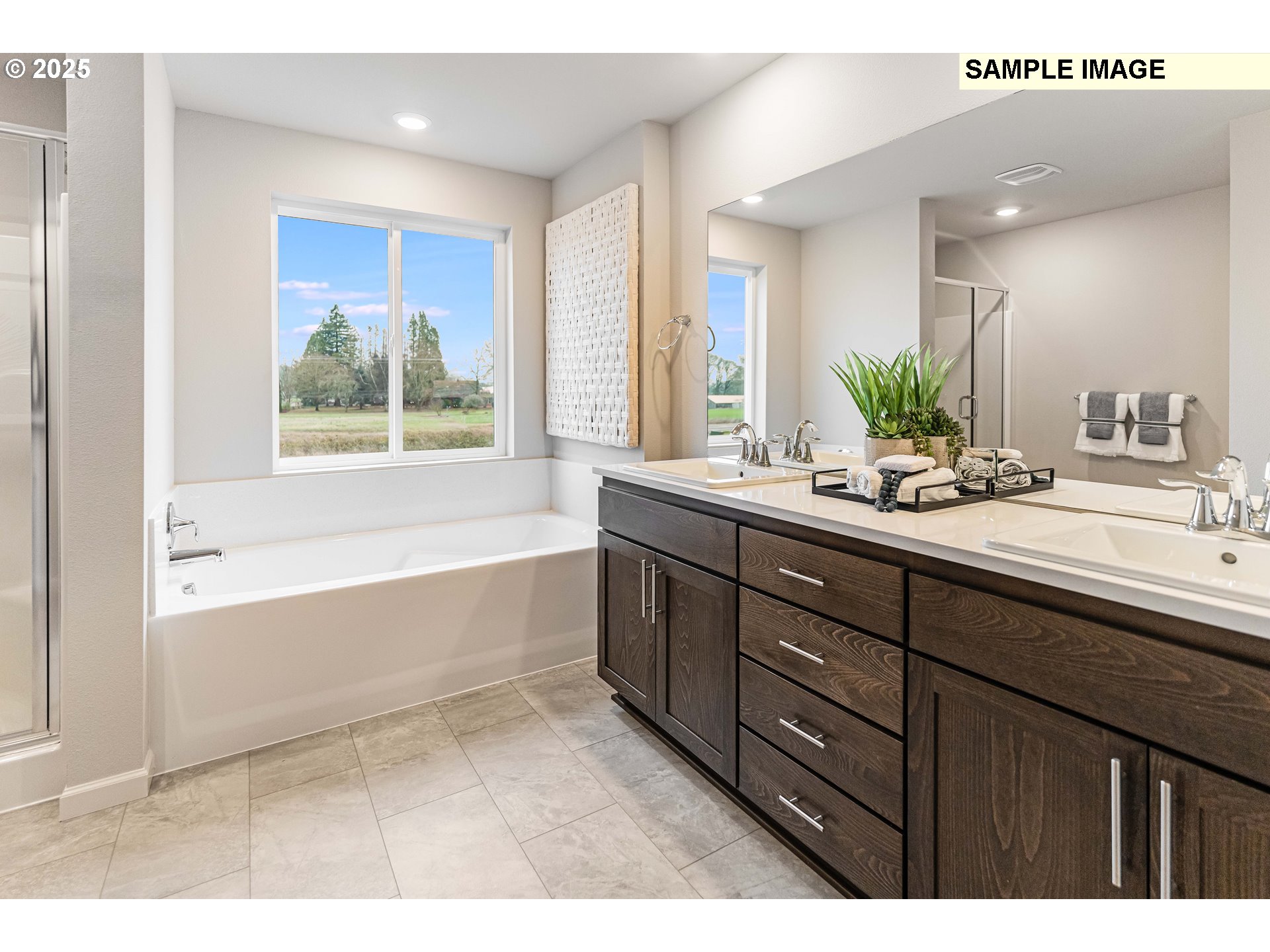 8921 Southwest Choke Cherry Tualatin, OR 97062 - Photo 24 of 28 a bathroom with a tub sink and mirror