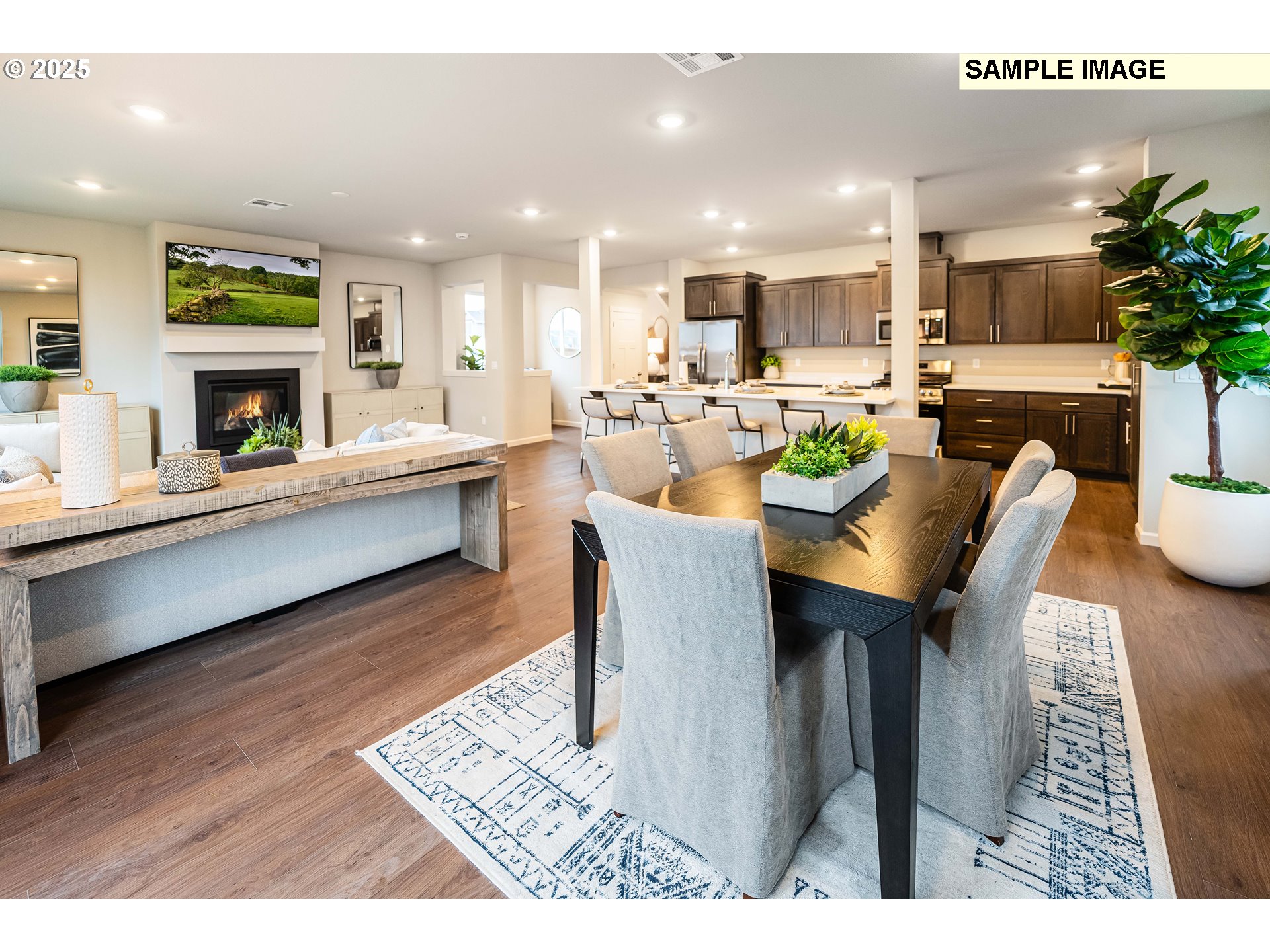 8921 Southwest Choke Cherry Tualatin, OR 97062 - Photo 8 of 28 a large kitchen with a table and chairs in it