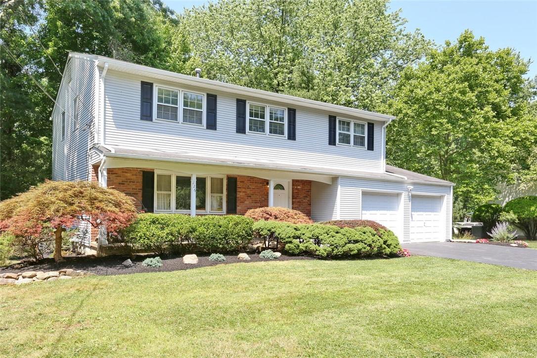 226 Liberty Road Tappan, NY 10983 - Photo 1 of 1 View of front facade with a garage and a front lawn