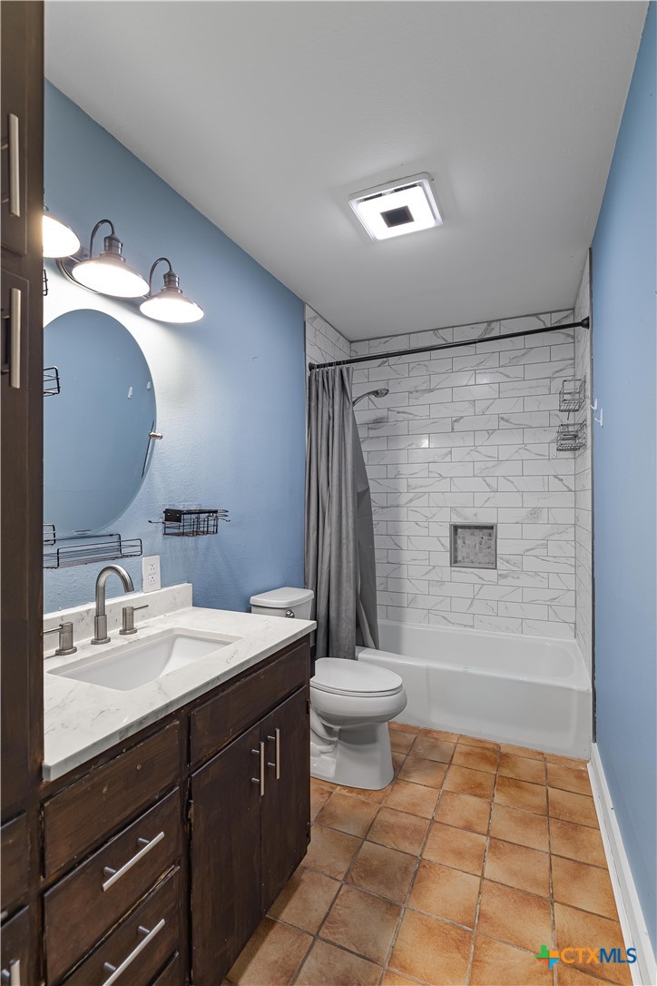 20 Hambleton Road Victoria, TX 77905 - Photo 15 of 48 a bathroom with a sink a toilet a mirror and shower